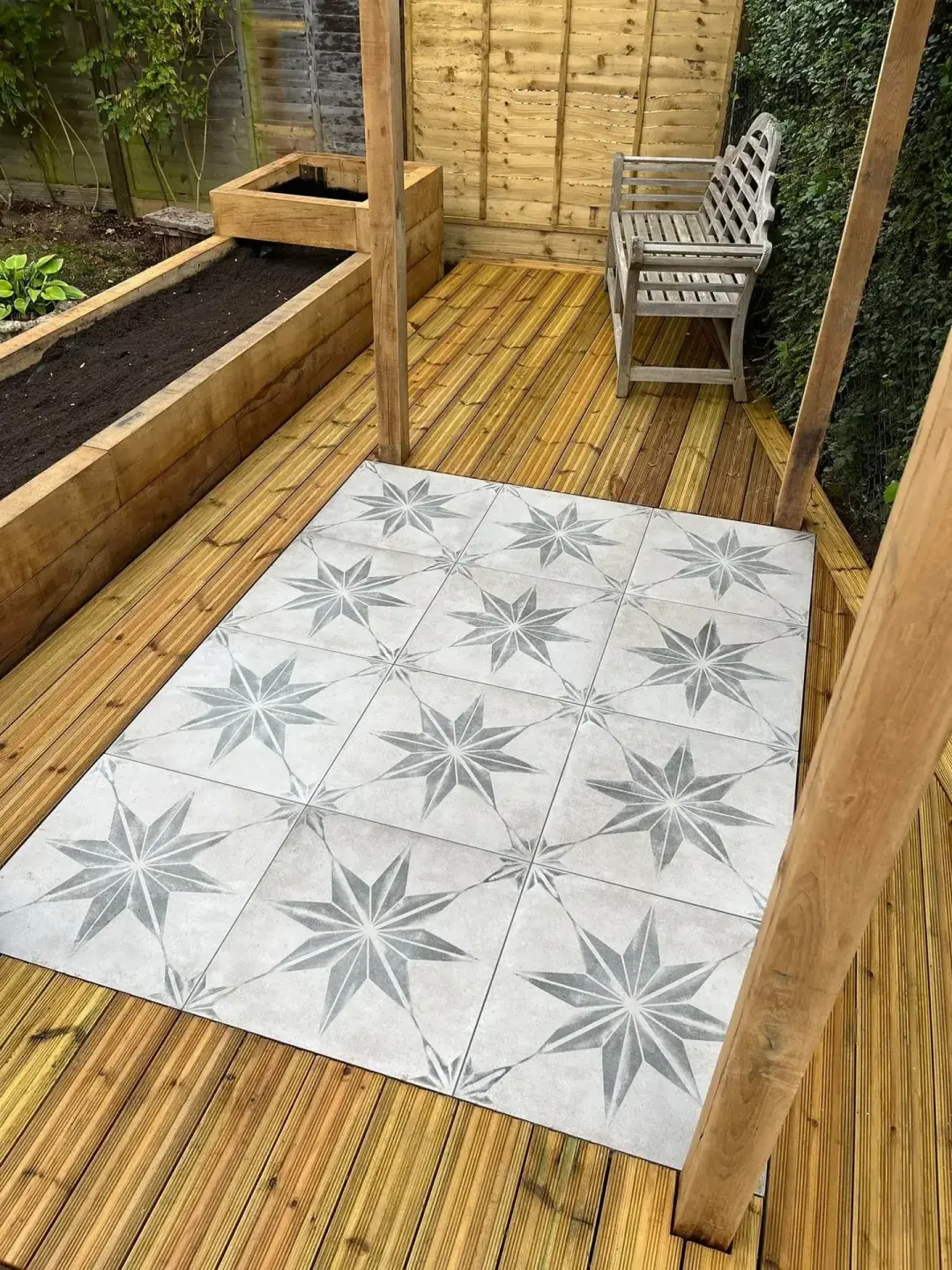 Timber decking installation with contemporary garden screening