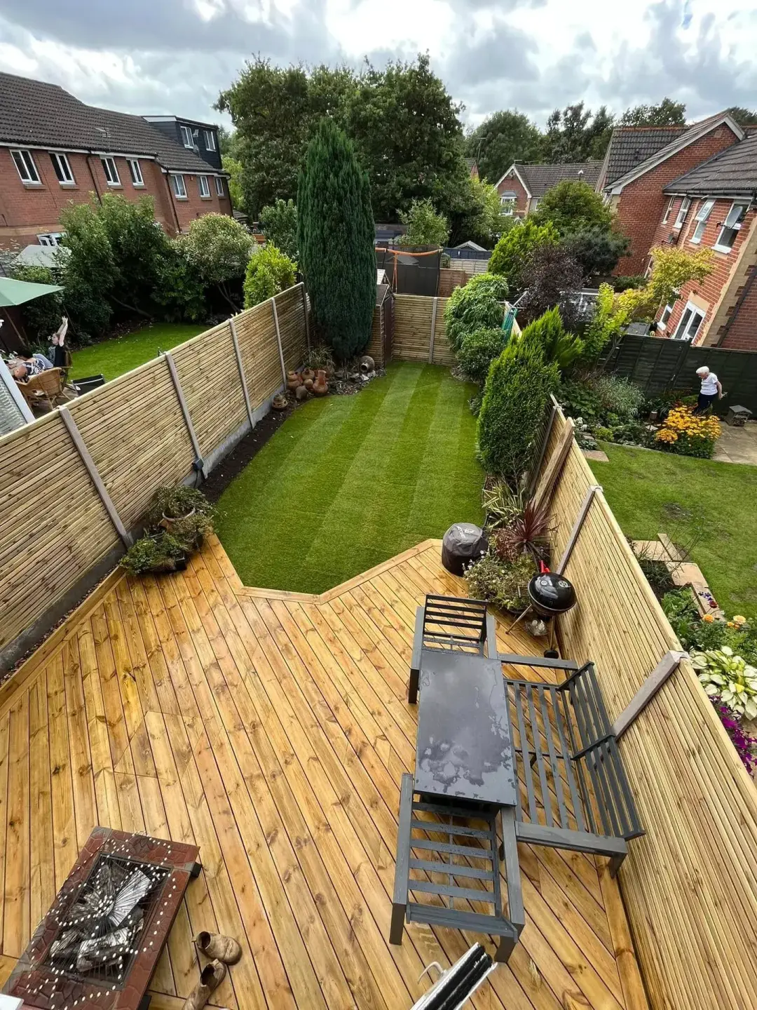 Layered soft and hard landscaping with planting and structure